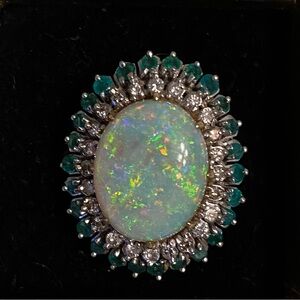 Stunning Opal Ring surrounded by Diamonds & Emeralds in 14K gold setting